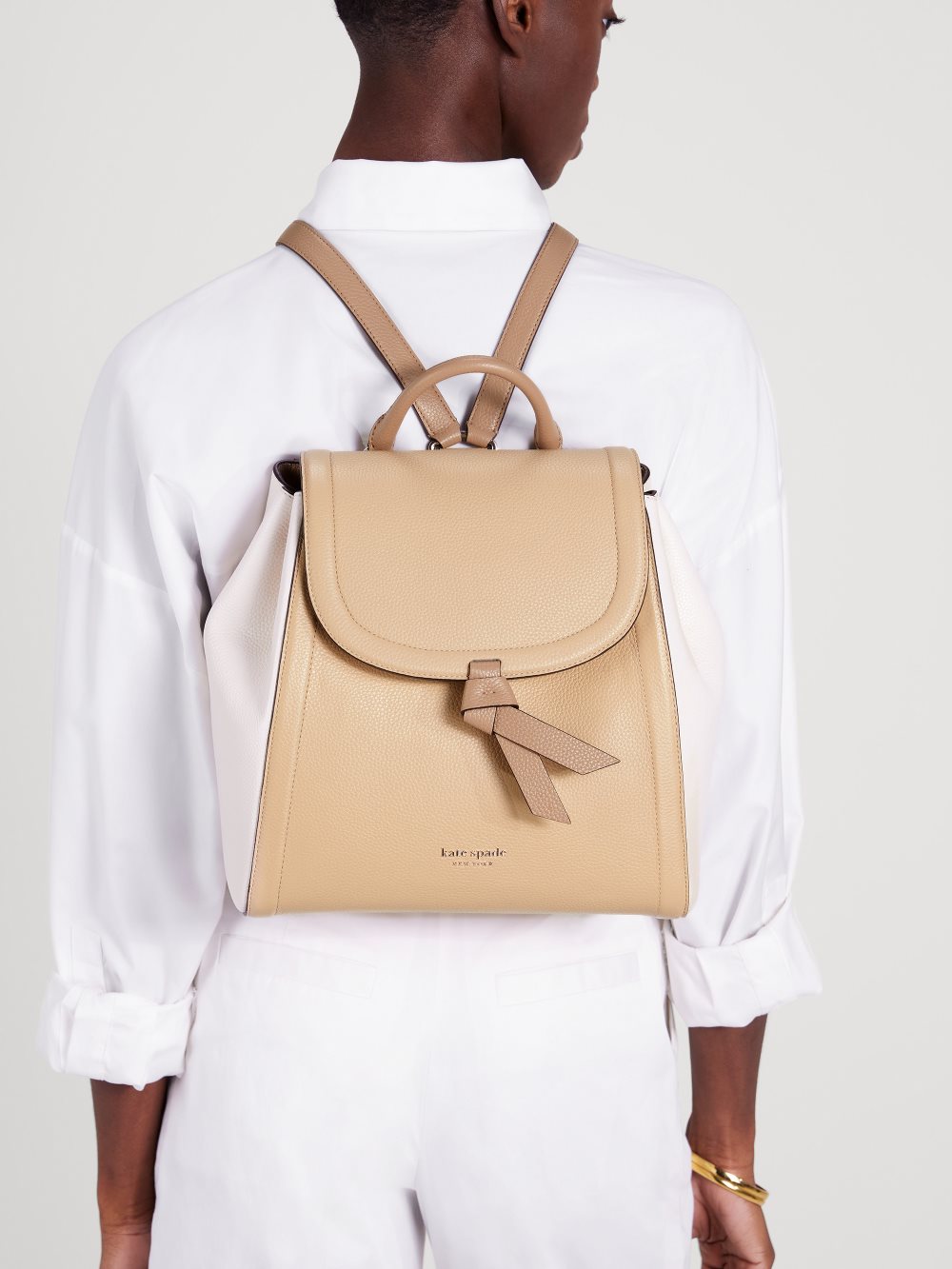 Women's warm stone multi knott colorblocked medium flap backpack | Kate Spade